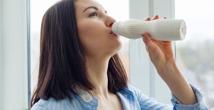 young-beautiful-woman-with-bottle-of-milk-yogurt-2022-03-16-22-13-45-utc