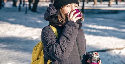a-little-girl-outside-with-thermos-on-a-cold-winte-2022-01-06-03-43-12-utc