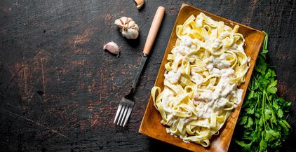 pasta-fettuccine-with-carbonara-sauce-on-plate-wit-2021-08-30-04-18-43-utc