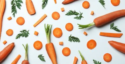 carrots-slices-and-leaves-of-carrot-on-white-back-2021-09-02-06-35-31-utc
