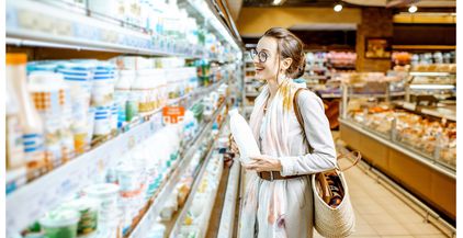 woman-buying-milk-in-the-supermarket-2021-09-02-07-25-06-utc