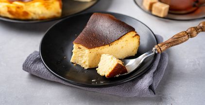 creamy-basque-burnt-cheesecake-with-cup-of-tea-2022-01-06-21-51-00-utc