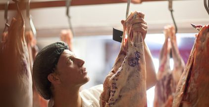 butcher-inspecting-meat-2022-03-07-23-57-15-utc