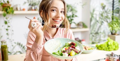 woman-eating-healthy-food-2021-12-23-15-41-16-utc