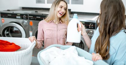 women-with-detergent-and-clothes-in-the-laundry-2021-09-02-04-29-28-utc