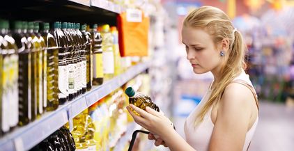 young-woman-buying-olive-oil-2022-02-03-03-29-42-utc