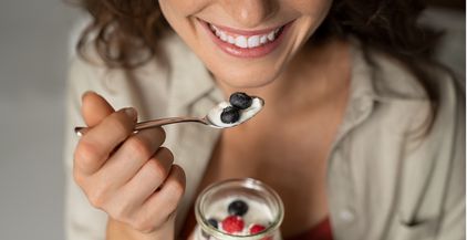 close-up-of-woman-eating-berries-and-yogurt-2021-08-29-23-41-24-utc