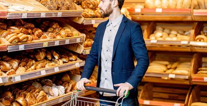 man-choosing-bakery-in-the-supermarket-2021-09-02-07-24-05-utc