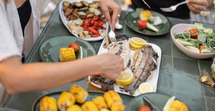eating-grilled-fish-and-vegetables-close-up-2021-09-04-12-15-57-utc