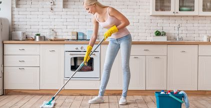 smiling-cleaning-service-woman-with-mop-cleaning-f-2021-10-21-02-45-32-utc