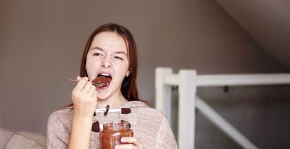 happy-teenager-girl-enjoying-eating-chocolate-crea-2021-08-29-20-41-26-utc