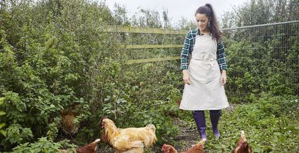 woman-wearing-apron-on-chicken-farm-2022-03-04-01-50-17-utc