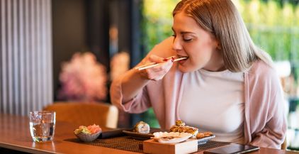 woman-eating-sushi-2022-03-15-19-54-28-utc