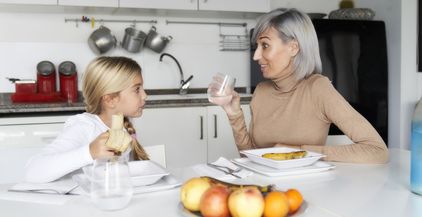 mother-and-daughter-eating-fruit-in-the-kitchen-f-2022-02-16-02-29-17-utc