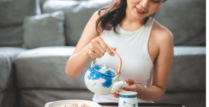 asian-woman-person-relaxing-with-hot-tea-to-drink-2022-01-18-23-59-58-utc