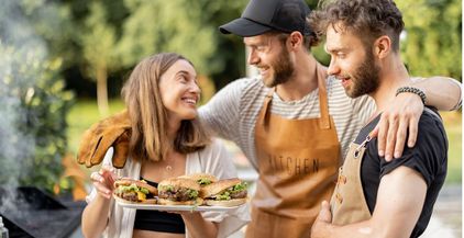 friends-enjoy-burgers-on-a-picnic-2021-09-04-12-15-51-utc
