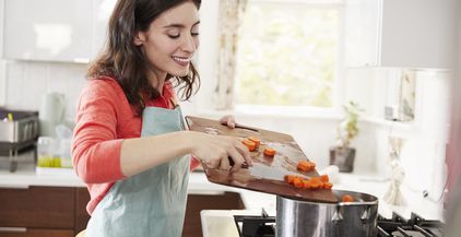 woman-cooking-carrots-in-kitchen-for-jewish-passov-2021-08-26-16-13-45-utc