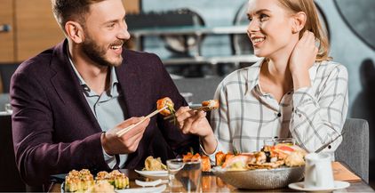 attractive-smiling-couple-having-dinner-in-restaur-2022-01-19-00-04-55-utc