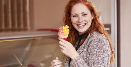 portrait-of-happy-redheaded-woman-with-ice-cream-c-2022-03-08-01-02-42-utc (1)