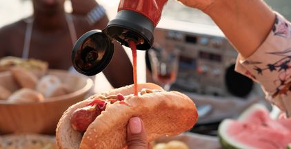 eating-hot-dog-with-sauce-2021-08-29-00-34-08-utc
