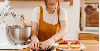 beautiful-concentrated-pastry-chef-woman-making-ta-2022-02-01-22-36-35-utc