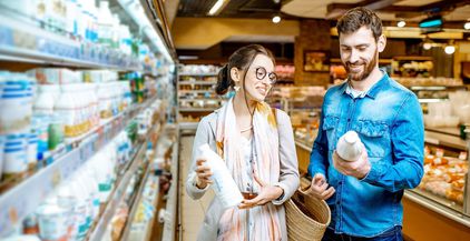 couple-buying-dairy-products-in-the-supermarket-2022-01-19-00-17-36-utc